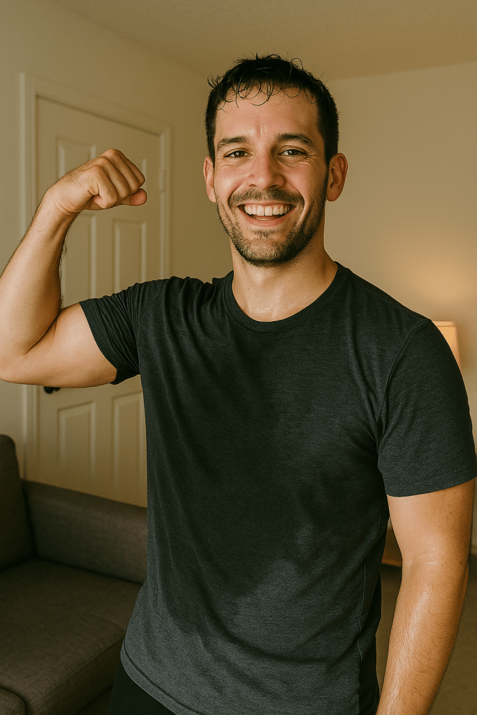 Happy person flexing after a home strength workout showing real results on a budget.