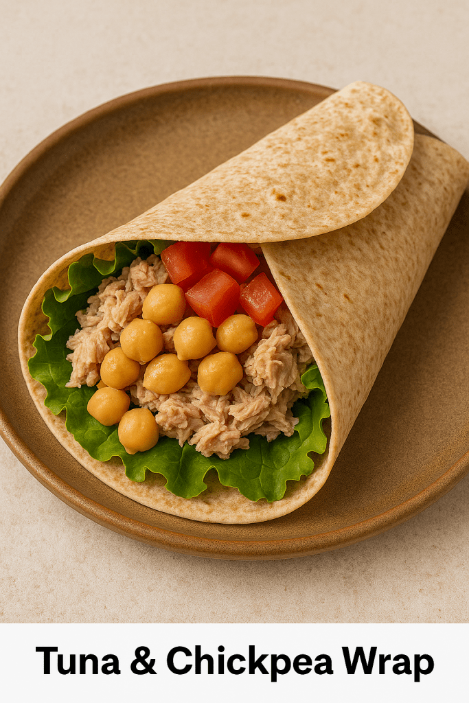 High-protein tuna and chickpea wrap made with pantry staples on a rustic wooden board.