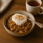 “Healthy baked apple crisp with oats and cinnamon in a rustic bowl — cozy fall dessert idea.”